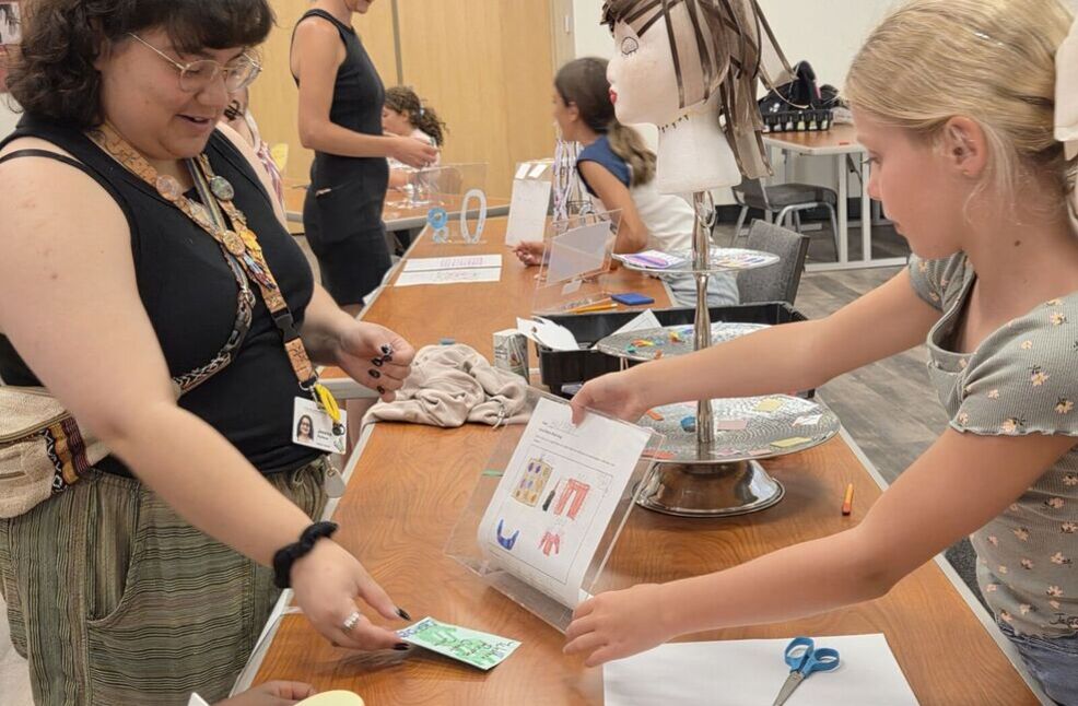 Camper and CHC staff member in entrepreneur market place